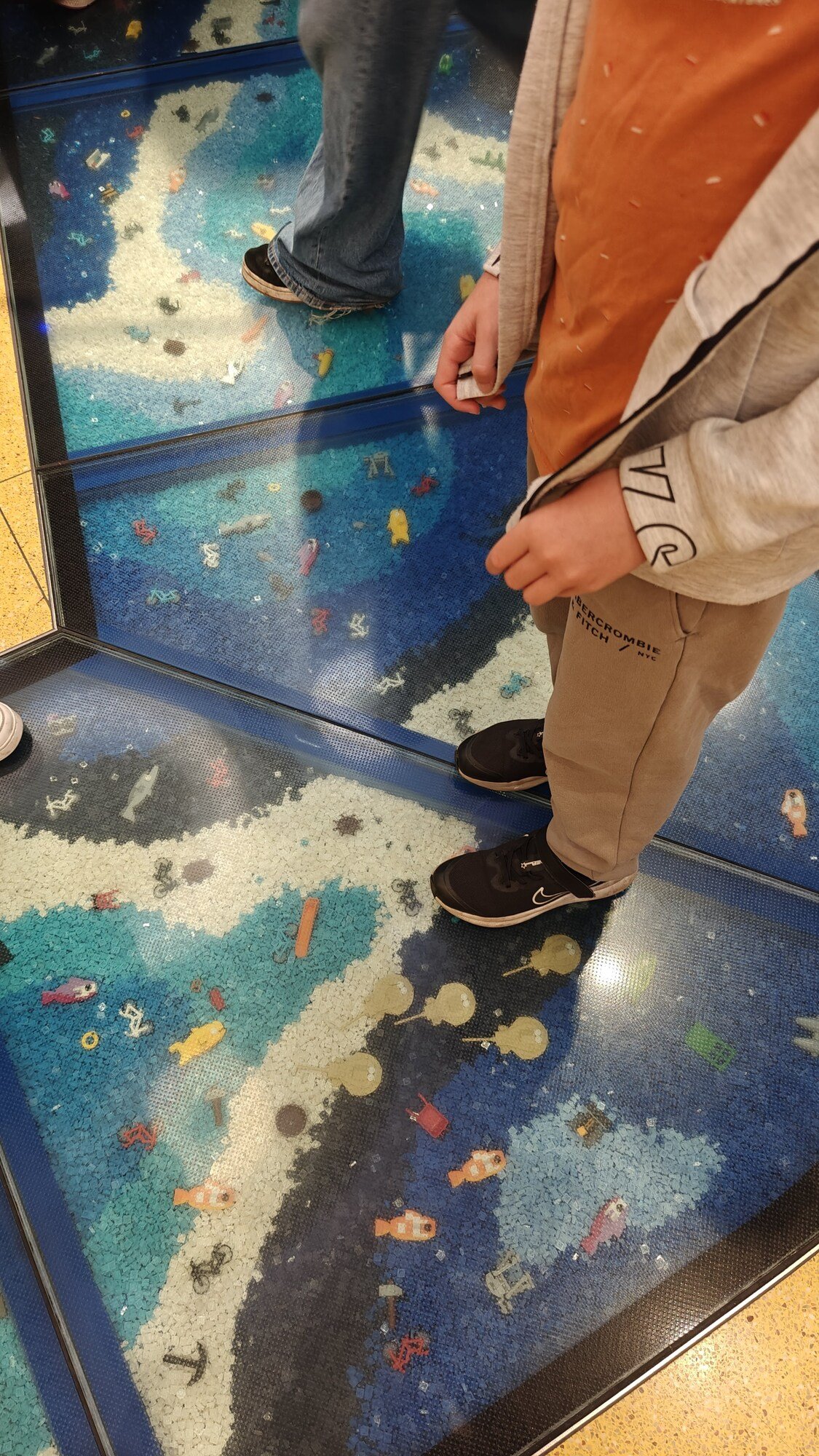 Son’s feet on the built-in LEGO® floor with ocean models
