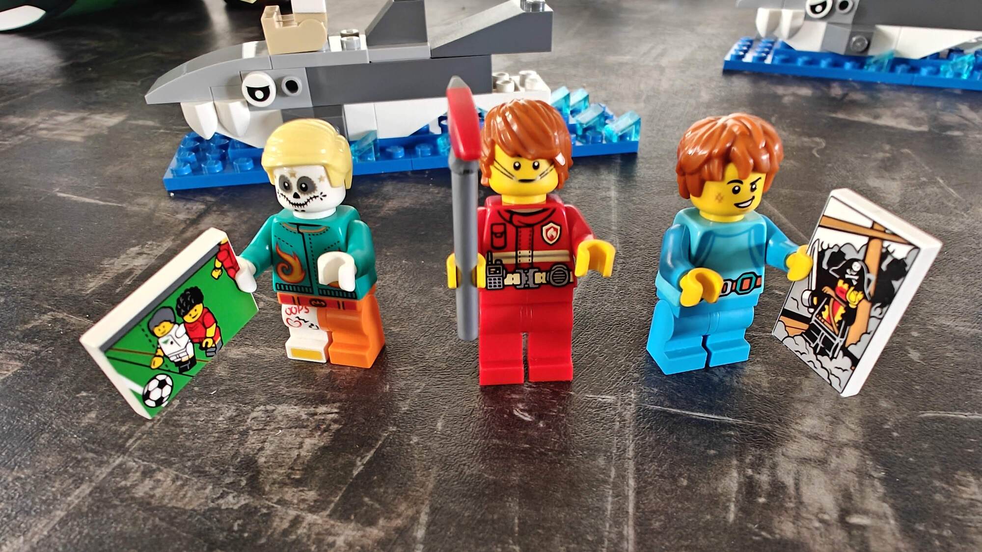 Three minifigs built in the LEGO® Store, posing side by side